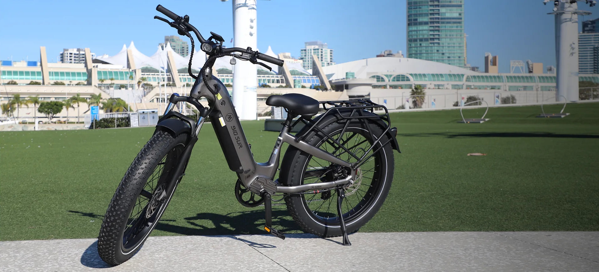 Electric bike on a city street with modern buildings in the background