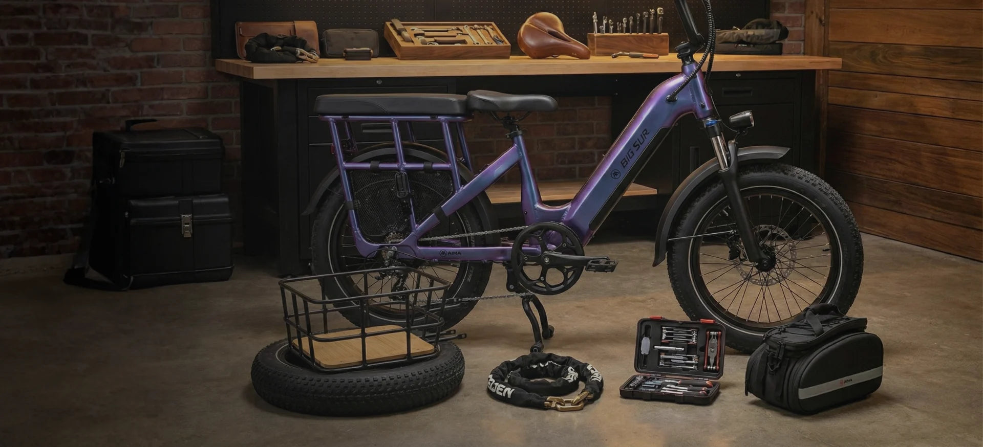 AIMA Ebike Accessories Purple bicycle with accessories on a concrete floor against a brick wall.