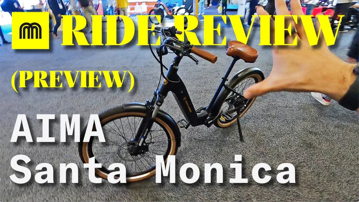 Electric bike on a road with text overlay about a ride review preview for AIMA Santa Monica.